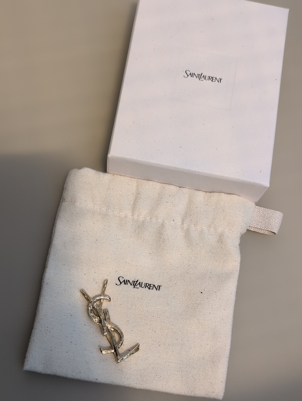 Saint Laurent Gold YSL Logo Pin with Ivory Canvas Pouch